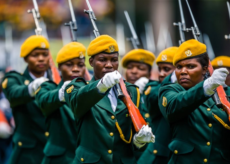 Soldiers march as Zimbabwe's new interim President reviews the honour guard for the first time after being sworn-in at the National Sports Stadium in Harare, on November 24 2017. Emmerson Mnangagwa was sworn in as Zimbabwe's president on November 24, mark