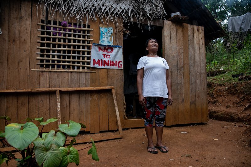 Ading Releno, anti-mining member of the Mangyan-Tagabukid indigenous community affected by the ongoing mining operations in Sibuyan Island, stands outside her house with a