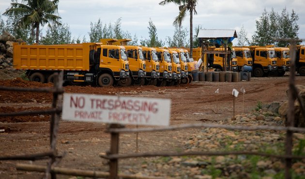 Dump trucks are seen inside a mining site in Sibuyan Island, Romblon province, central Philippines