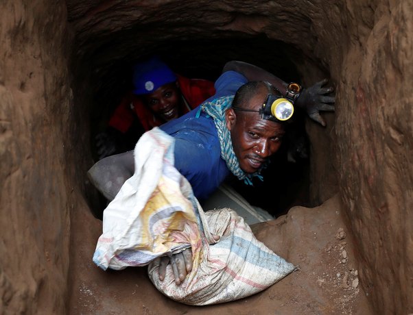 drc mineral miner climbing out of mine